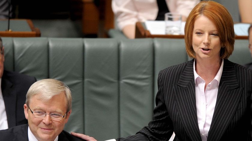 Prime Minister Kevin Rudd receives a pat on the shoulder from deputy Julia Gillard