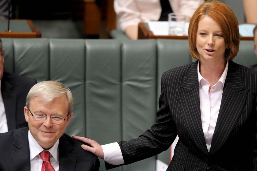 Kevin Rudd receives a pat on the shoulder from deputy Julia Gillard.