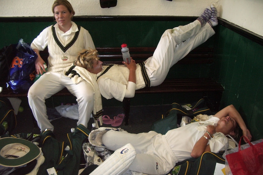 Alex Blackwell sits looking tired, Emma Liddell lies on her lap, and Julia Price is on the floor lying down with arm over face