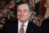 Italian Premier Mario Draghi looks on after the swearing-in ceremony