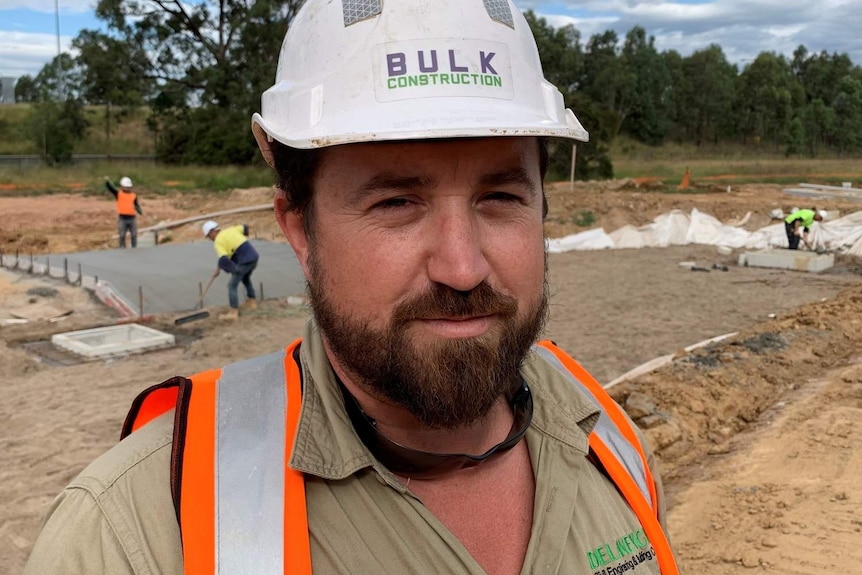 a man in a hard hat at a construction site