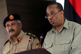 Major-General Abdessalem Jadallah al-Salihin (L) and Libya's interim premier Abdullah al-Thinni (R)