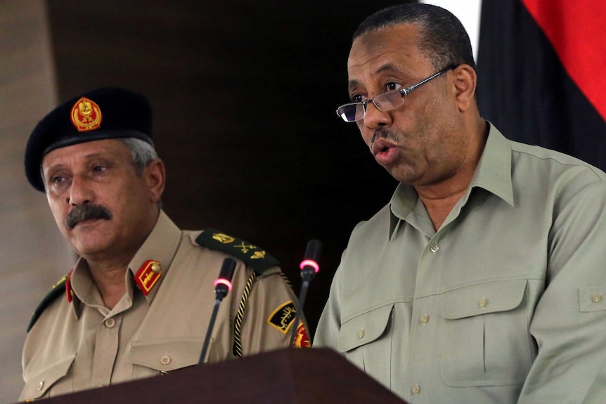 Major-General Abdessalem Jadallah al-Salihin (L) and Libya's interim premier Abdullah al-Thinni (R)