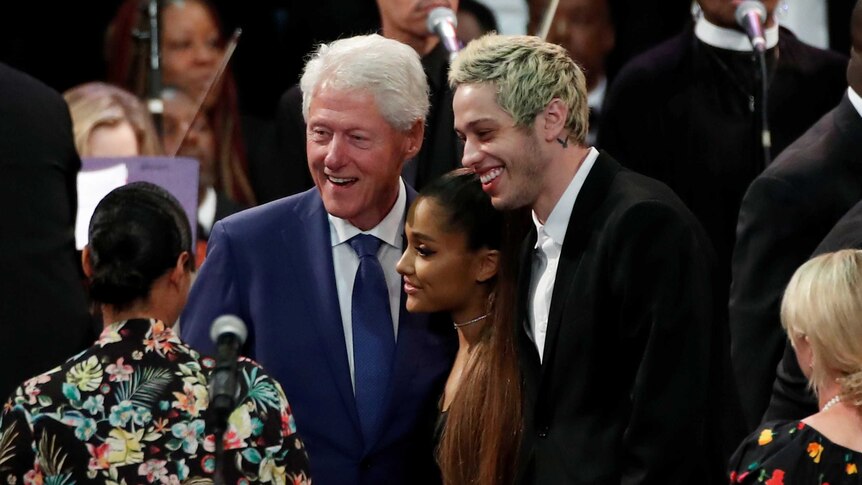 Bill Clinton poses with singer Ariana Grande and her boyfriend Pete Davidson.