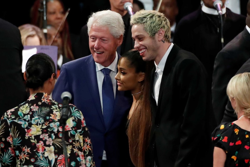 Bill Clinton poses with singer Ariana Grande and her boyfriend Pete Davidson.