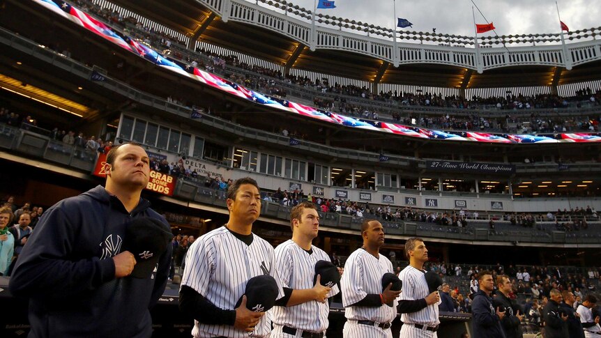 The New York Yankees observe a moment to honour the victims of the Boston Marathon bombings.