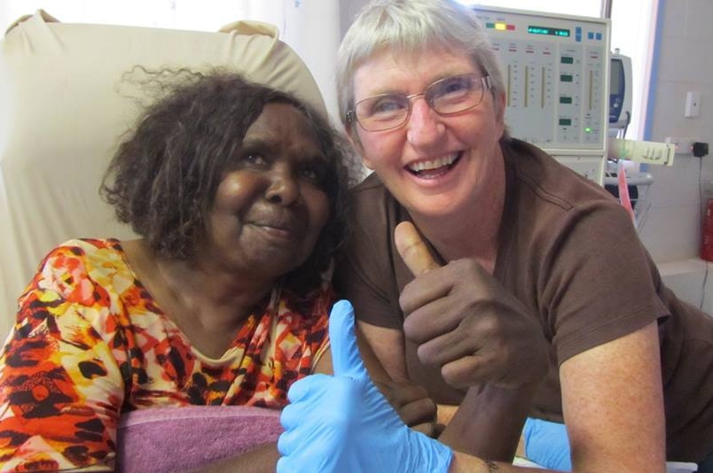 Dialysis nurse Ronnie Edmonds and Purple House patient give the thumbs up to treatment.