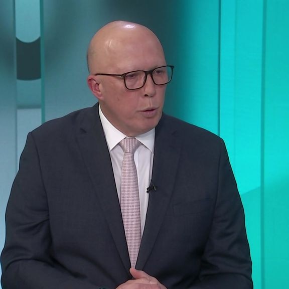 Peter Dutton sits on the set of 7.30 during an interview with Sarah Ferguson.
