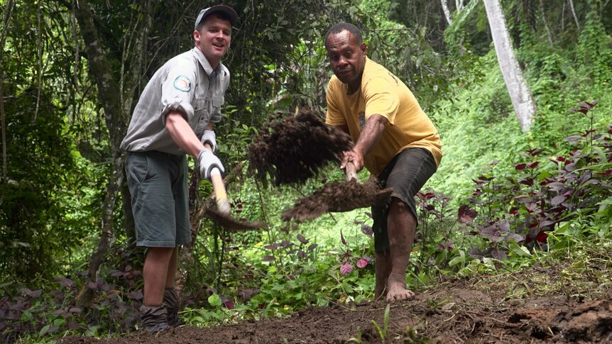Ranger Pat Kirby and local landowner Stanley Enage work on a section of the Kokoda Track in PNG.