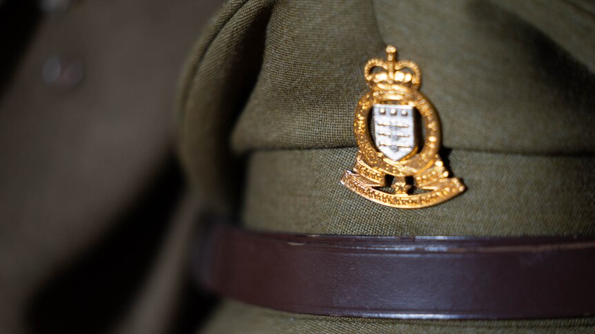 A close up photo of an olive-green Australian Army cap.