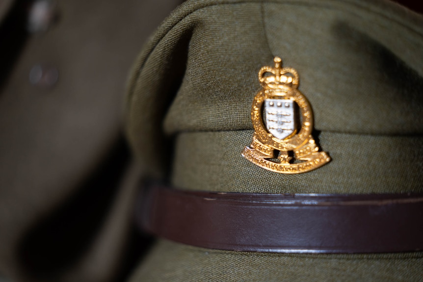 A close up photo of an olive-green Australian Army cap.