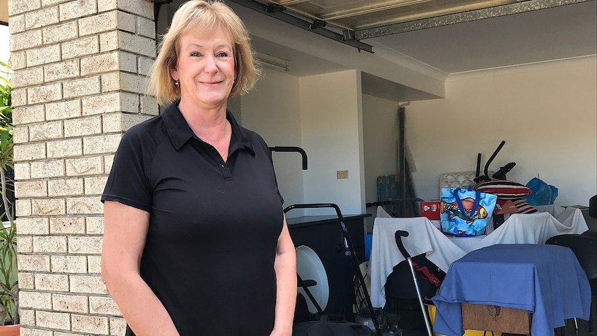 Gold Coast resident Liz Clifford stands outside her garage.