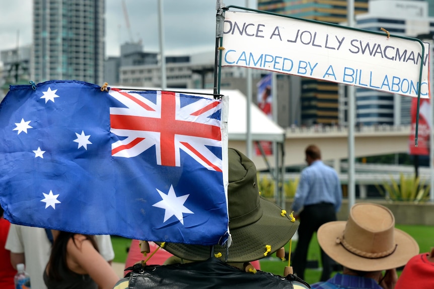 A Banjo Patterson fan walks through the crowd on Australia Day.