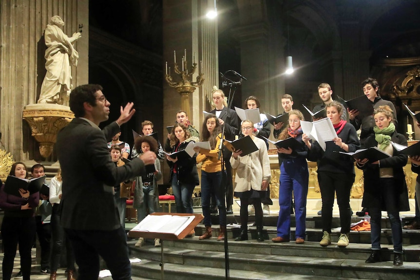 Henri Chalet and the Notre Dame choir rehearse at the Saint Sulpice church in Paris