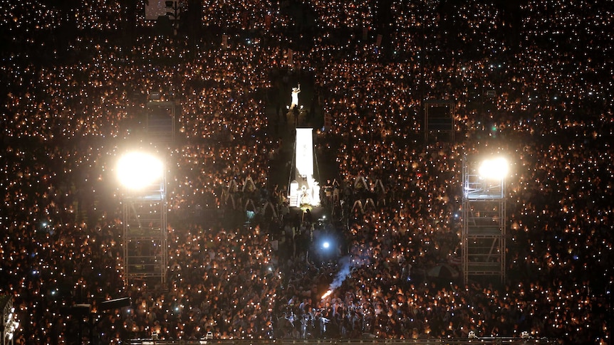 Tens of thousands attend an annual candlelight vigil at Hong Kong's Victoria Park (Photo: AP/Kin Cheung)