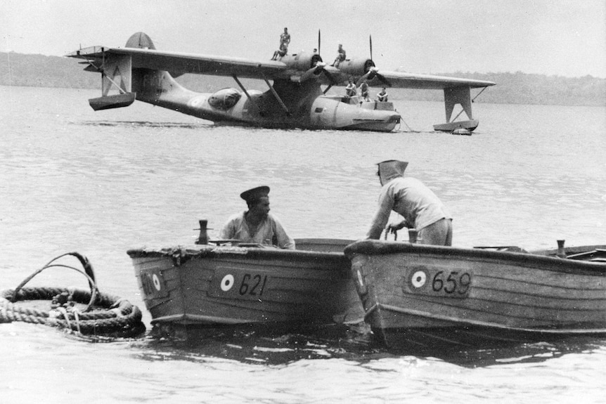 RAAF boats with landed Catalina.
