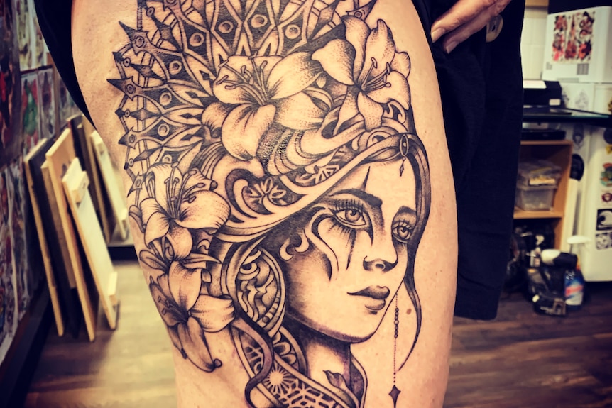 A picture of a large tattoo on someone's leg