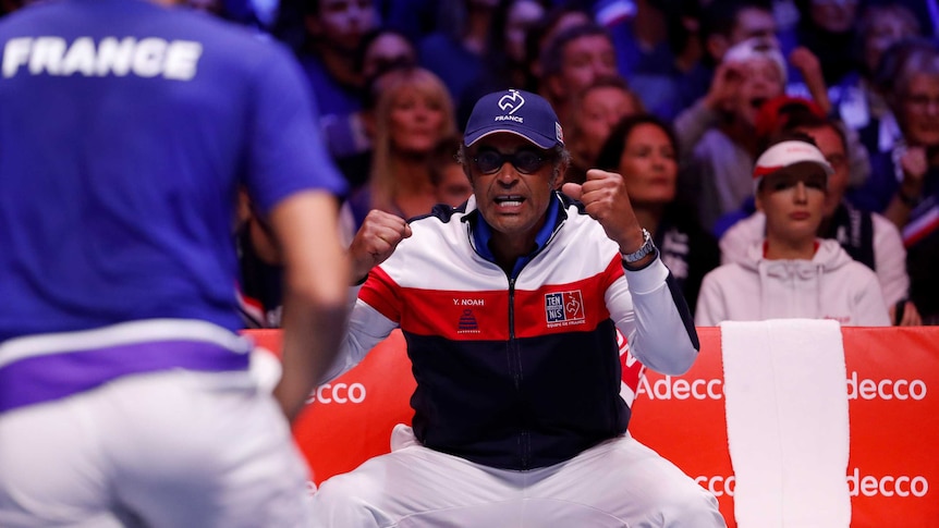 Yannick Noah encourages France's Jo-Wilfried Tsonga from courtside