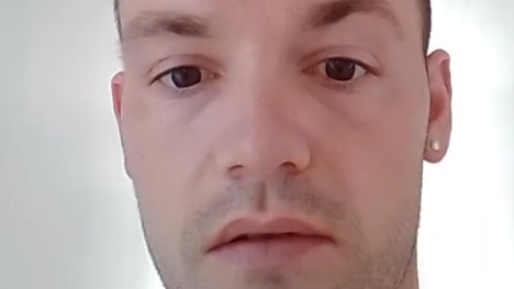 A close-up image of a man's face taken from a social media video.