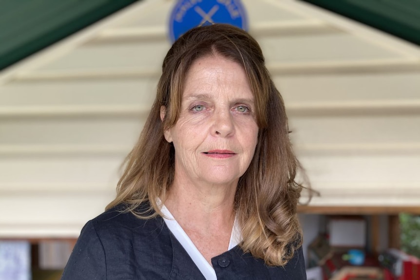 A woman with medium length brown hair.