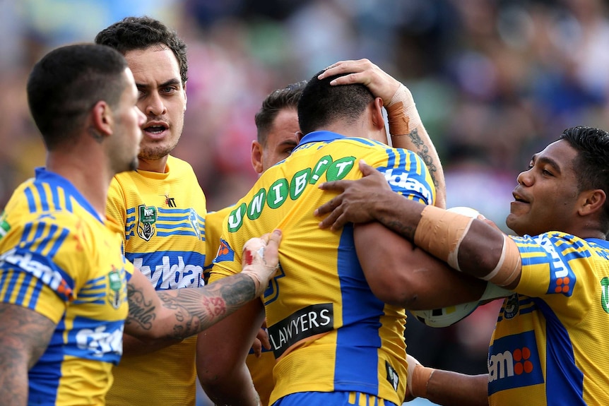 Parramatta Eels celebrate a try against the Newcastle Knights