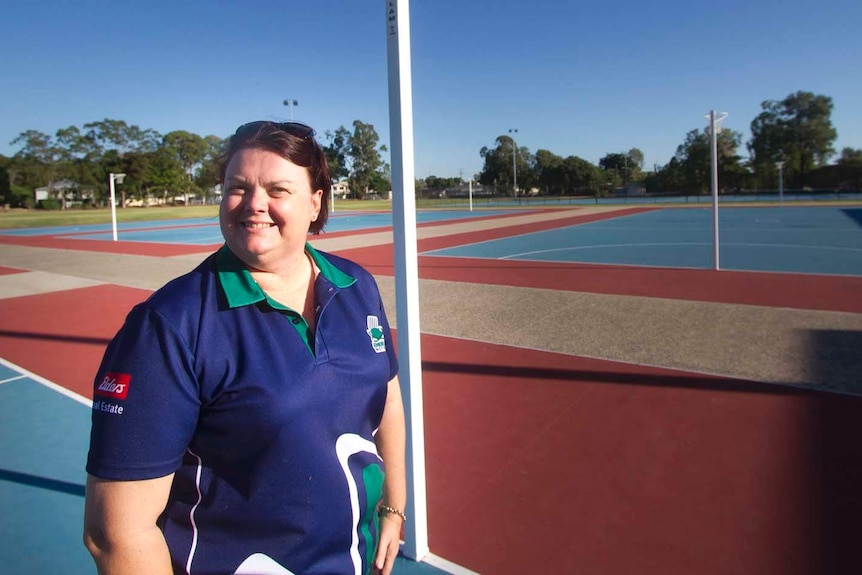 Emerald Netball Association coaching convenor Debbie Hall stands on the court.