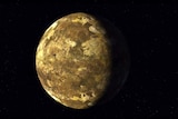 Brown planet sits against black background with a shadow over a quarter of the planet on the right-hand side.