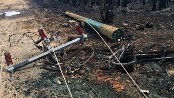 One of almost 1,000 power poles damaged in the South-West fire.