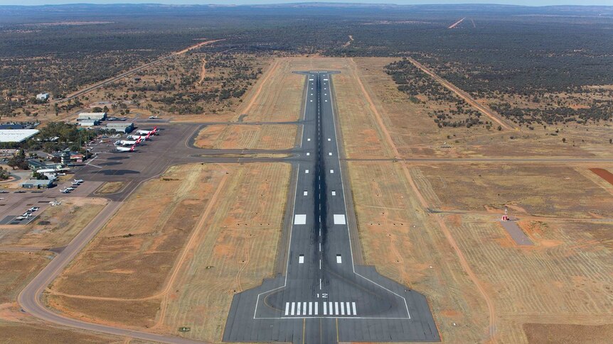 An aerial shot of a runway at Alice Springs Airport.