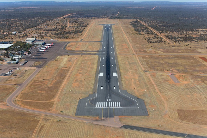 An aerial shot of a runway at Alice Springs Airport.