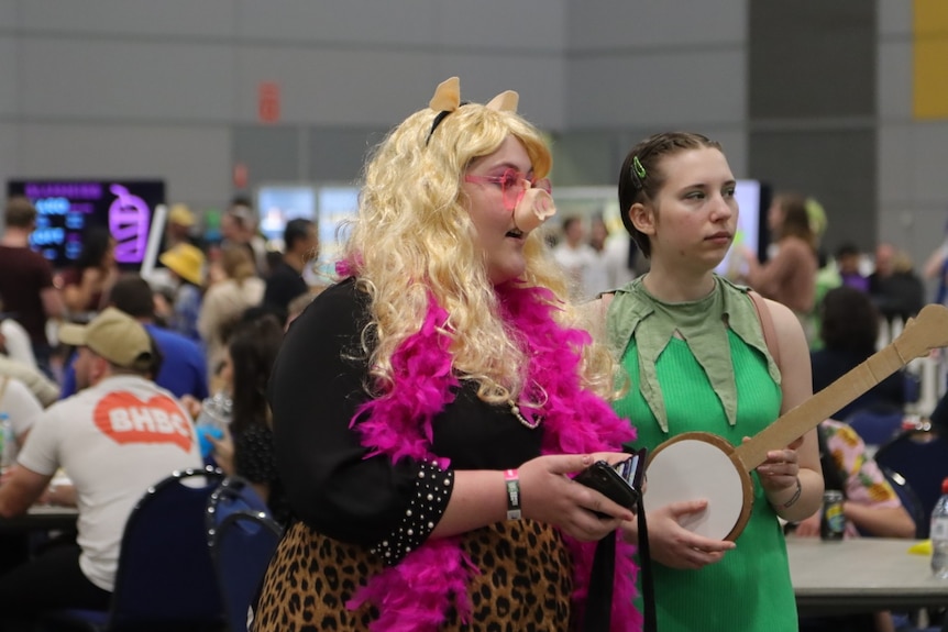 Two women dressed up. 