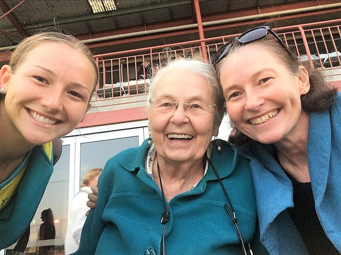 A selfie with a young girl in sports uniform, her granny and mother, all smiling