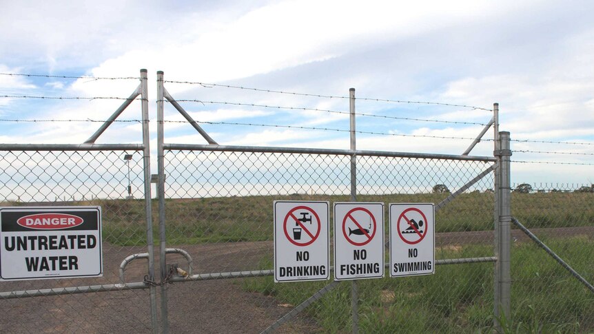 Advisory signs outside Santos's Leewood Ponds plant in the Pilliga State Forest.