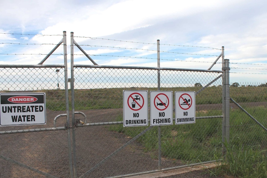 Advisory signs outside Santos's Leewood Ponds plant in the Pilliga State Forest.