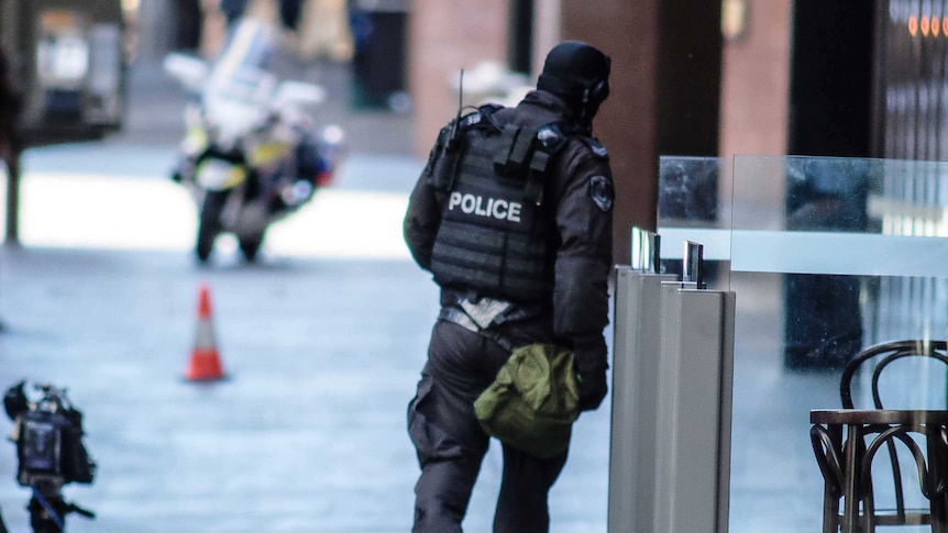 Police officer near site of siege in Sydney's Martin Place