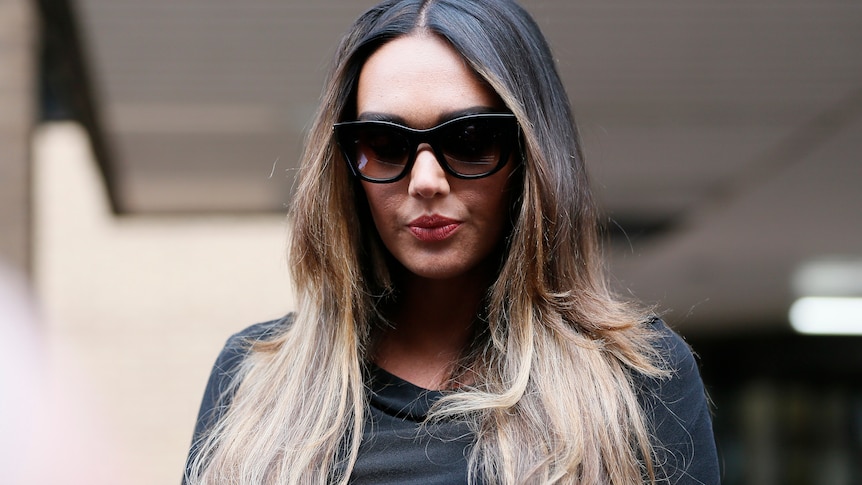 Woman in black sunglasses 
