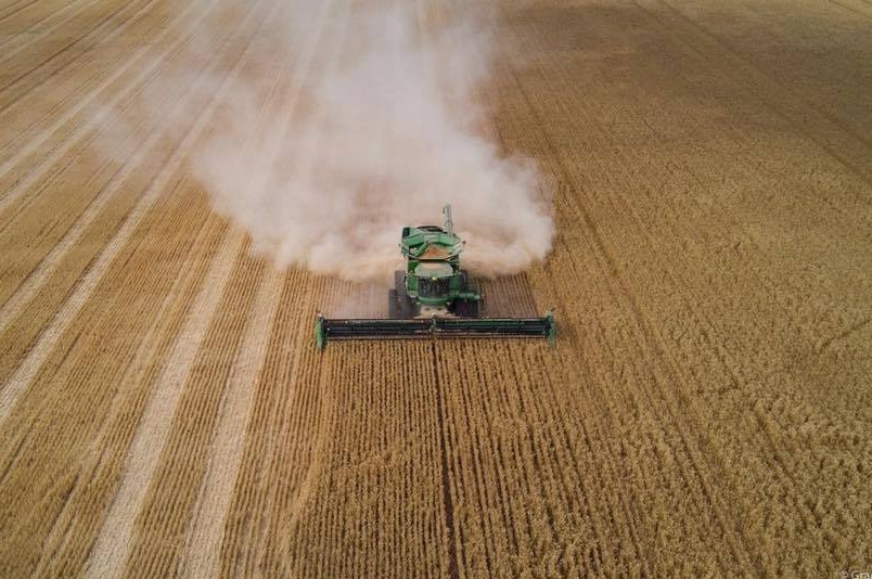 A drone shot of a tractor in a field in Western Australia
