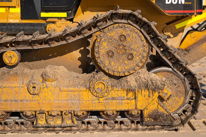 A tracked vehicle used to cart sand.