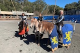 A group of knights seated on horseback at Kryal Castle near Ballarat in Victoria, May 2020.