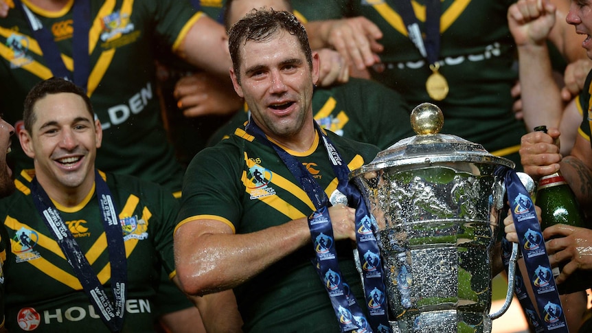 Australian captain Cameron Smith holds the Rugby League World Cup after the Kangaroos' victory.