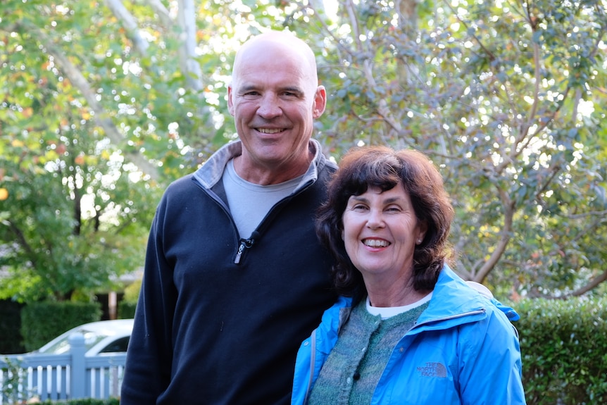 Jenny and Michael stand in the garden.