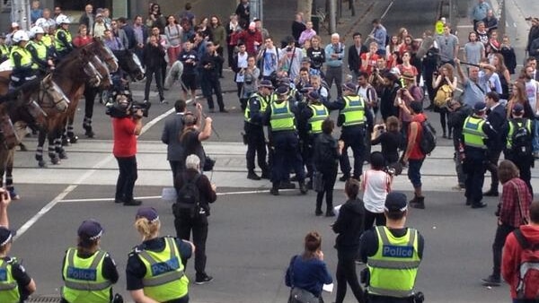 Police remove student protesters from outside of Parliament House on Spring Street, Melbourne