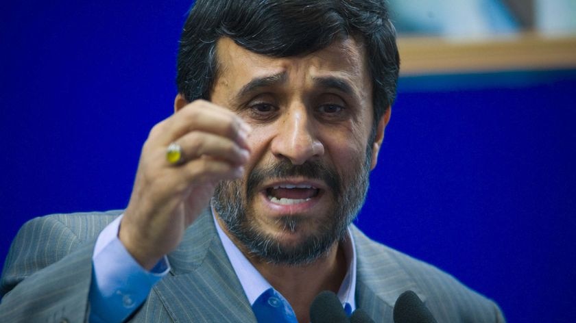 Ahmadinejad gestures as he speaks