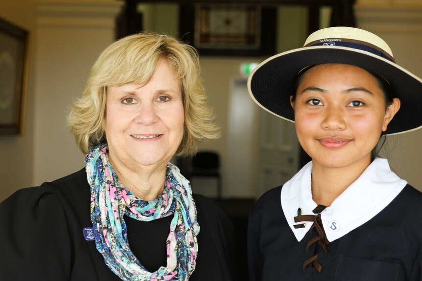 Student Alicia Goh and principal Ros Curtis stand beside each other for this photo.