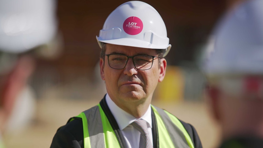 Steven Marshall in a high-vis vest and wearing a white hard hat