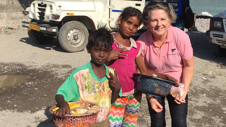 Dr Sally Williams with children in India.