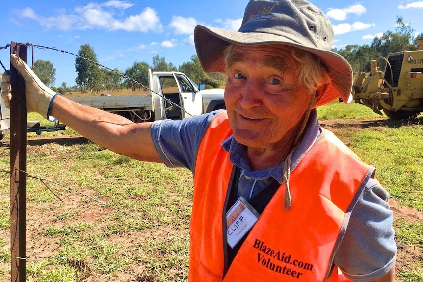 Victorian Cliff Charlton helps repair broken fence lines at Clarke Creek property.