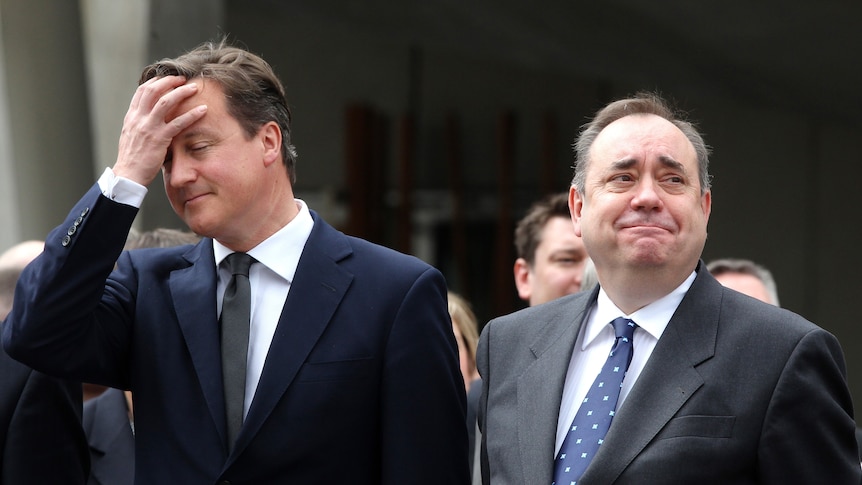 British prime minister David Cameron gestures as Scottish first minister Alex Salmond looks on