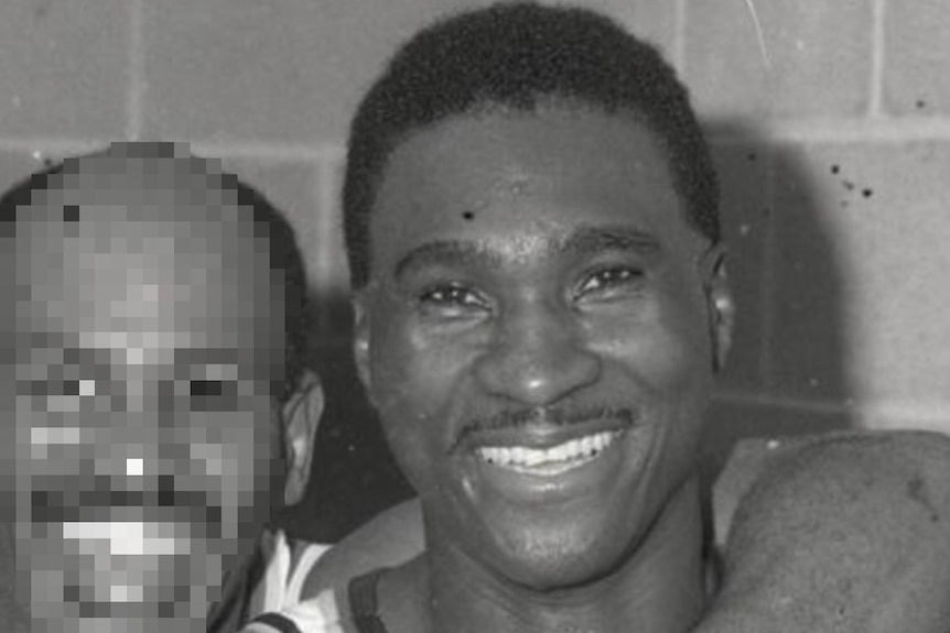 A black and white photo of a basketball player