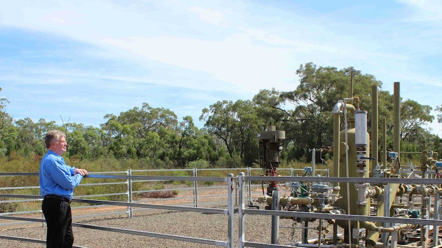 Santos's General Manager Energy NSW, Peter Mitchley, at a pilot well in the Pilliga.
